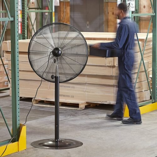 Industrial fan cooling a warehouse space.